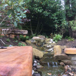 Another angle of modern stone sitting area and water feature in Angus