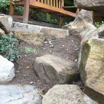 Stonework shaped as natural steps leading to sitting area Fife