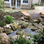Stone seating area with built-in water feature in Dundee