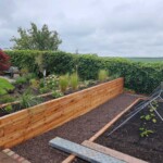 Modern garden design with timber planting area Angus